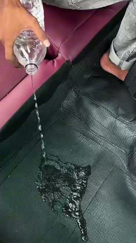Still from supplied footage showing water poured onto a Carzio floor mat